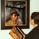 A museum visitor views “Self-Portrait with Jewish Identity Card” at a 1998 exhibit.